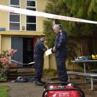 Fire investigators Michael Harrison, of Dunedin, and Mike Cahill, of Invercargill, prepare to...