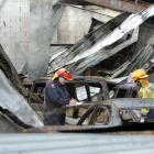 Fire risk management officers Stuart Ide (left) and Cathy Trevathan inspects the fire damage at...