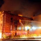 Firefighters attack the blaze in the Stavely Building from the outside about 4am yesterday after...