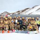 Firefighters walk up the slopes of Coronet Peak before competing in the K2 Climb on Friday. Photo...