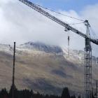 A sprinkling of snow covers Cecil Peak, near Queenstown as a crane works above the resort...