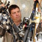 Fish and Game Otago operations manager Ian Hadland with an armload of gear recently seized from...