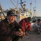 Fishermen, concerned over radiation levels in Japanese waters, pass time at Onahama port in Iwaki...
