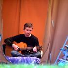 Florian Beyer, of Dunedin, practises his guitar playing at the Whare Flat Festival of Music and...