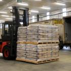 Fonterra forklift driver Shane Priest unloads milk powder from a train at the company's North...