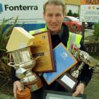 Fonterra Stirling site manager Mark Leitch is overloaded with trophies and awards won by the...