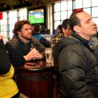 Brazil supporters (from left) Carolina Loch, of Florianopolis, Nathan Keen, of Dunedin, and DJ Zanicotti, in The Bog Irish Bar in Dunedin yesterday watch their team get beaten by Germany in the Fifa World Cup semifinal. Photo by Stephen Jaquiery