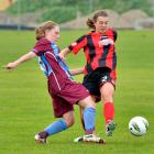 Footballsouth's Jordan Walker (left) challenges Canterbury's Meikayla Moore during the national...