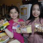 Forbury School pupils Charlene Phuong (left) and Lily Young (both 10) in the school's new kitchen...