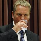 Former detective sergeant Milton Weir has a drink while giving evidence during the David Bain...