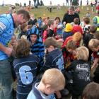 Former Highlander Kelvin Middleton (left) and former Wallaby Michael Briar are surrounded by...