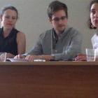 Former intelligence agency contractor Edward Snowden and Sarah Harrison (left), of WikiLeaks,...