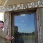 Former Poolburn Hotel leaseholder Larry Connell closes the pub doors for the final time yesterday...