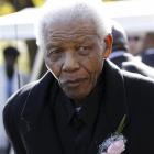 Former South African President, Nelson Mandela leaves the chapel after attending the funeral of...