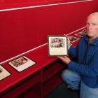 Former Tomahawk School pupil Michael Bradshaw looks at photos of past pupils of the school, at an...