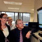 Forsyth Barr brokers (from left) Suzanne Kinnaird, Haley Van Leeuwen and Tom Bliss watch the...