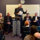 Forum convener Prof Kevin Clements (standing) speaks  at a joint health board/mayoralty forum,...