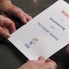 Four Wanaka women with a Cancer Society document they hope to sign so they can resume voluntary...