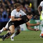 France's Dimitri Szarzewski tackles Richard Kahui during their Rugby World Cup Pool A match at...