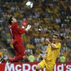 France's goalkeeper Hugo Lloris jumps for the ball next to Ukraine's Yevhen Selin. REUTERS/Yves...