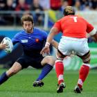 France's Maxime Medard (L) tries to avoid Tonga captain Finau Maka. Photo: REUTERS/Anthony Phelps