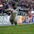 France's Wesley Fofana dives to score a try against Italy. REUTERS/Benoit Tessier