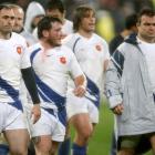 French players leave the field dejected after their loss against New Zealand in the international...