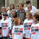 Friends support  Sean Davison (centre)  outside the Dunedin District Court yesterday. Inset, top,...
