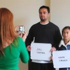 From left, extras casting assistant Jacqui Nairn photographs prospective cast extras Joel and...