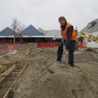 Fulton Hogan Cromwell Mall redevelopment site manager Johnny Tags works on what will be a schist...