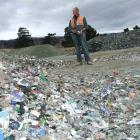 Fulton Hogan Parkburn Quarry supervisor Dave Rogers inspects the stockpile of contaminated glass...