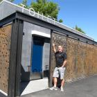 Gary Anderson checks out the "flash" new public toilets in Cromwell. Photo by Sarah Marquet.