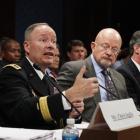 General Keith Alexander (second from left), director of the National Security Agency (NSA),...