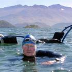 Geoff Wilson leaves his wheelchair behind in Lake Wanaka yesterday, in preparation for the Wanaka...