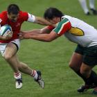 Georgia's Malkhaz Urjukashvili (left) fends off South African Kings' Clint Newland during an IRB...