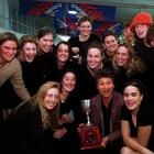 Georgie Salter shows off the Caltex Cup, surrounded by the members of the Otago netball team, on...