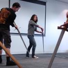 German long-sword exponent Jim Edmonds tutors Nikita Stevenson at a workshop held as part of the...