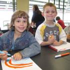 Getting stuck into creative expression was Zoe Barham (6) (left) and Cody Campbell (5). Photos by...