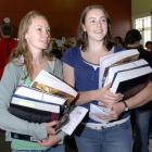 Getting their textbooks at discounted prices from the SCM Otago Book Exchange yesterday are Jess...