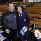 Taieri College pupil Renee Mikaere (16) has her photograph taken with V8 Supercar driver Greg...