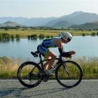 Gina Crawford, of Wanaka, rides  past Paddock Bay on her way to second place  in the Challenge...