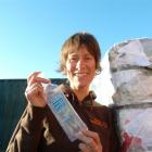 Gina Dempster  with a Charlie's bottle, which cannot be recycled in Wanaka.  Photo by Sophie Ward.