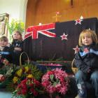 Girl Guides Lily Tepper (8, top left),  Ivy Tepper (6, left)  and Charlotte Elliott (5) with the...