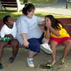 Girls share a laugh before lunch at a New Image Weight Loss Camp at Camp Pocono Trails in Reeders...