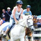 Glenorchy residents Vicki Leaf, on Silver, and Per Lindstrand, on Dezzie, charge forward in the...