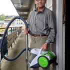Glenross Apartments tenant Stephen Hughes holds a vacuum cleaner he bought from a Home Direct...