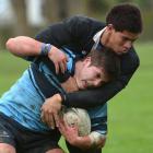 Going nowhere ... Waitaki Boys' High School centre Loni Fisiihoi holds King's High School hooker...