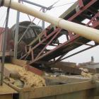 Gold being sieved from larger material at one of Glass Earth Gold's recovery units, pictured ...