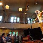 Gold-clad Dr Glam (Ian Chapman) performs David Bowie's Rebel, Rebel for University of Otago music...