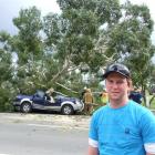 Gore farmer Matt Swney was counting his blessings after a massive gum tree fell on his truck,...